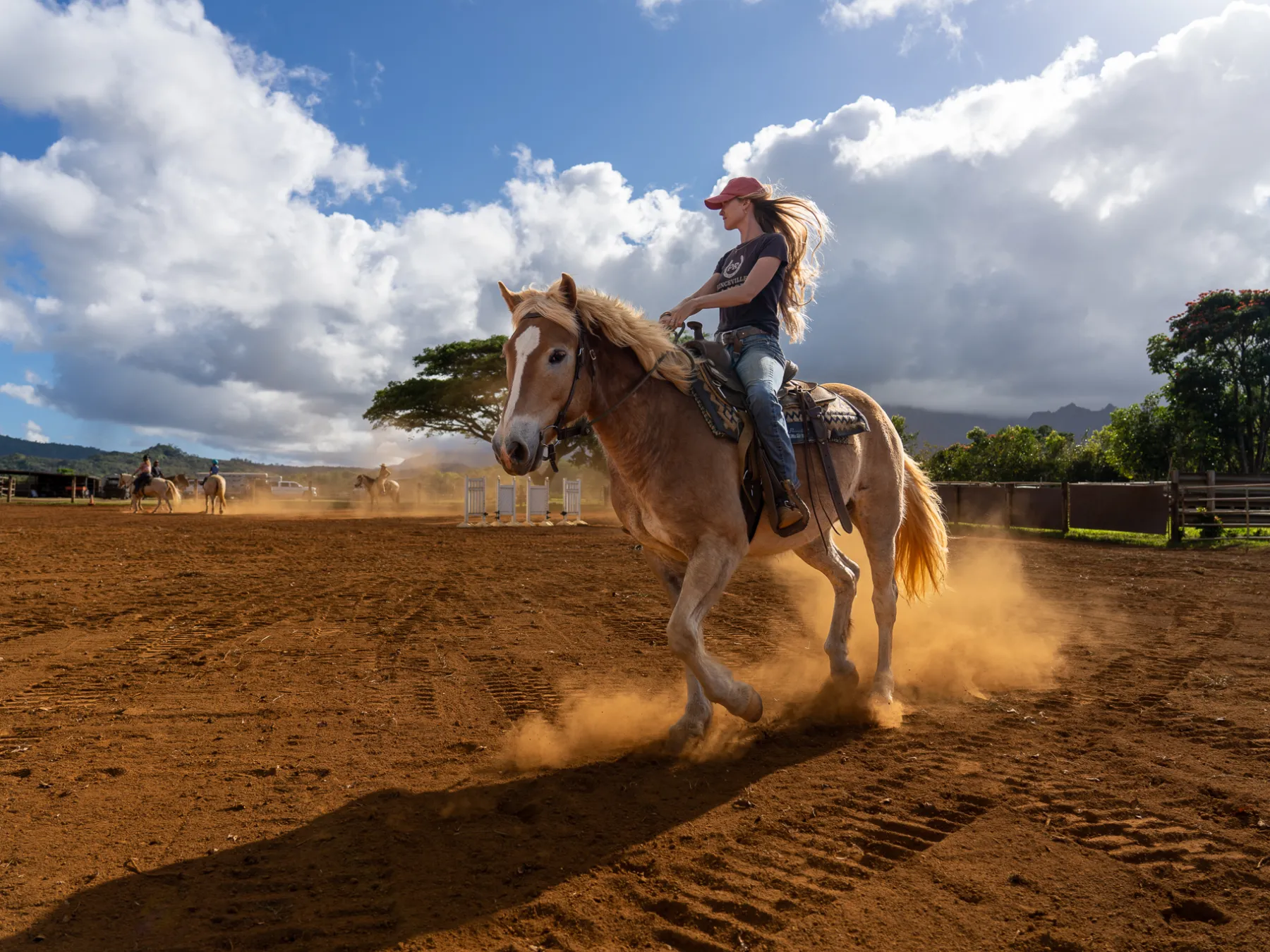a person riding a horse in a dirt field