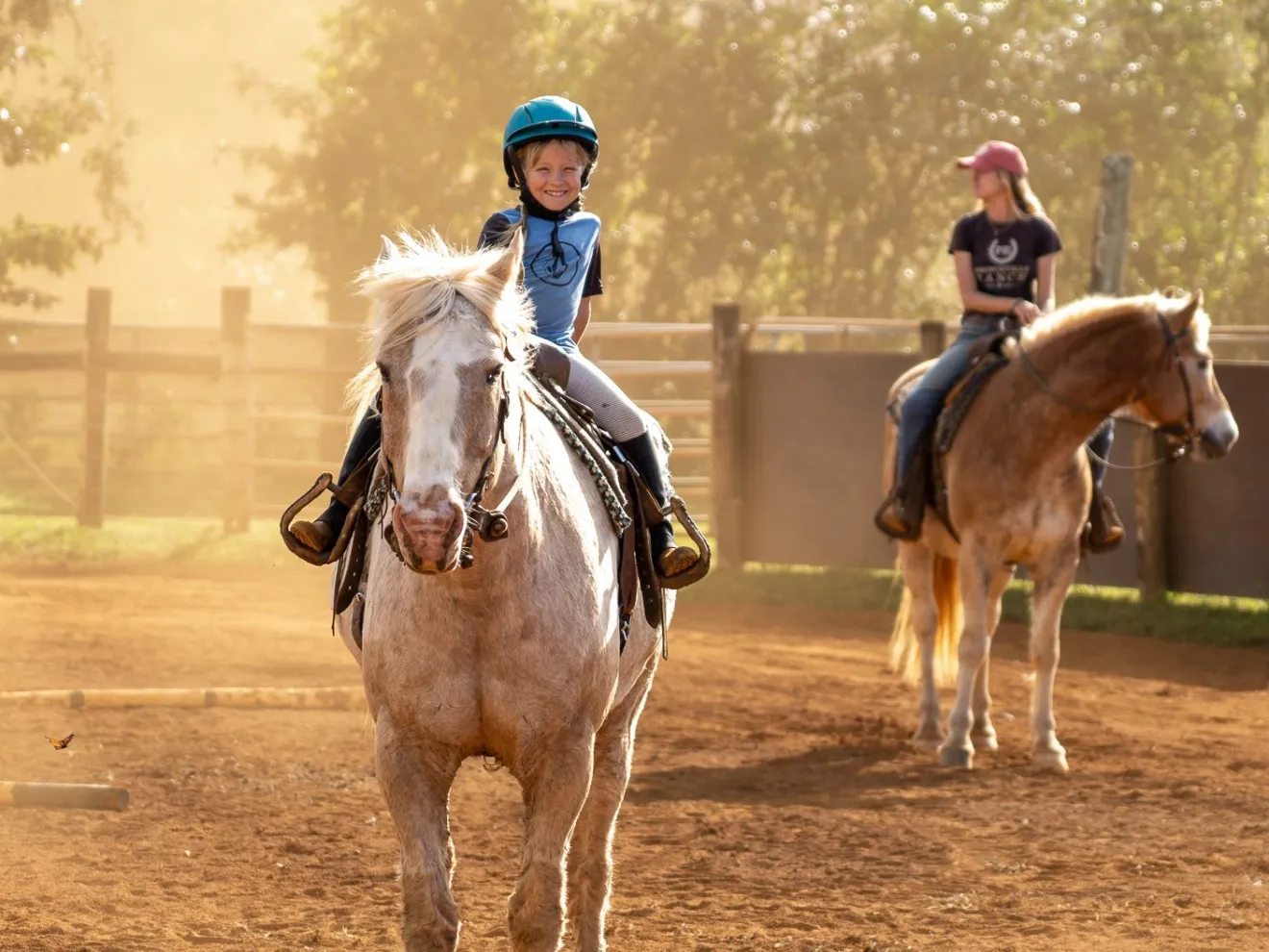 a man riding a horse in a dirt field