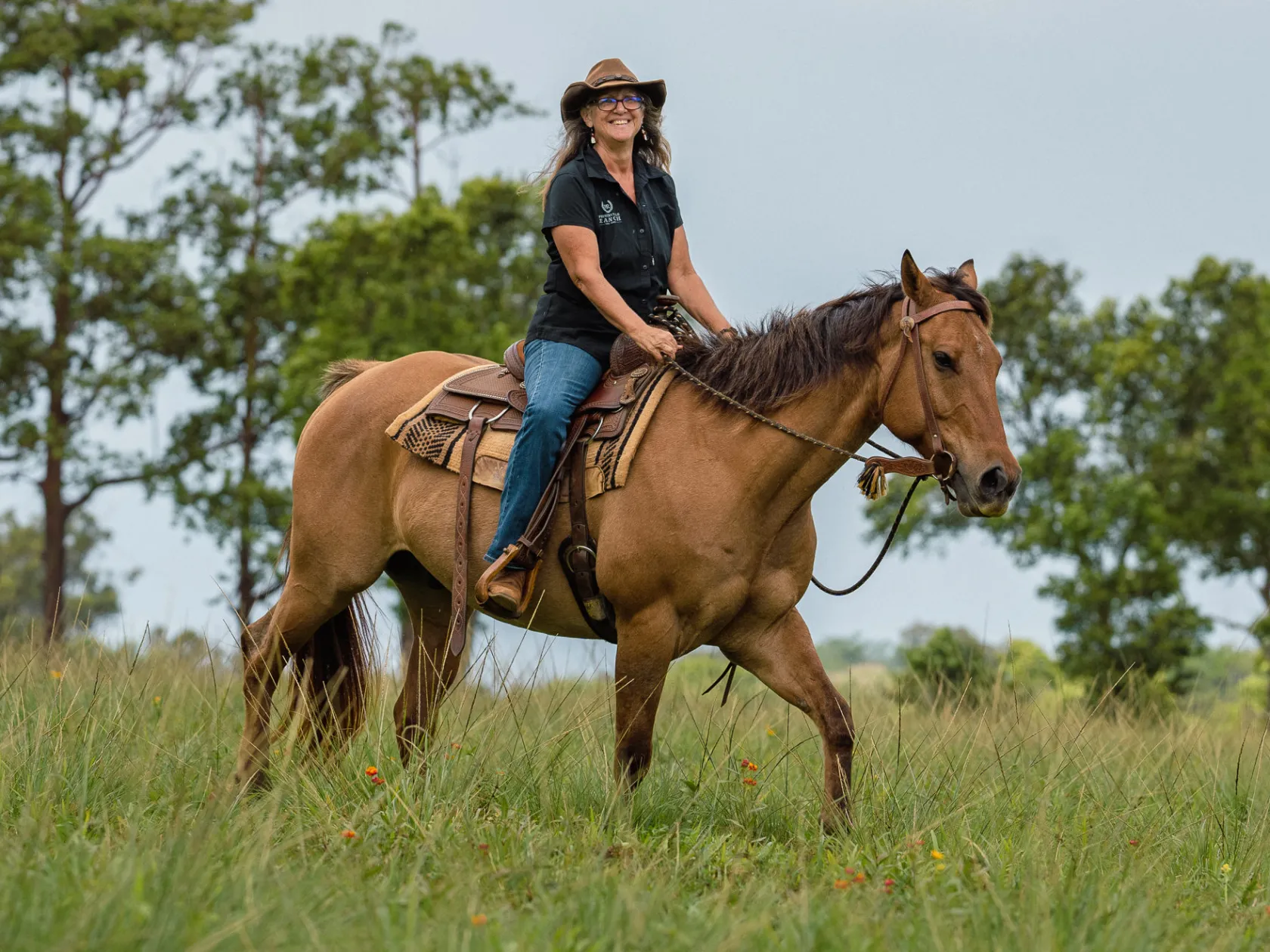 a man riding a horse in a field